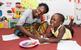  A mother and daughter color together in a Play Lab in Tanzania