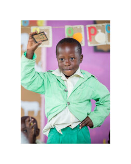 A photo of a child in a Play Lab in Uganda